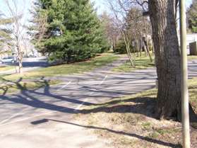 The trail crosses over an entrance to a church parking lot.