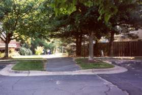 The trail cuts straight across Whisperwood Glen Ln.