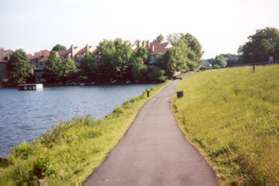 The trail crosses the Lake Thoreau dam with Lake Thoreau on the left.