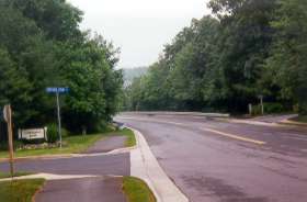 The trail crosses Twin Branches after Sentinel Point Ln.  The Lake Audubon pool where you started the walk is on the right at the bottom of the hill.
