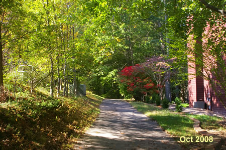 The trail cuts between the houses.