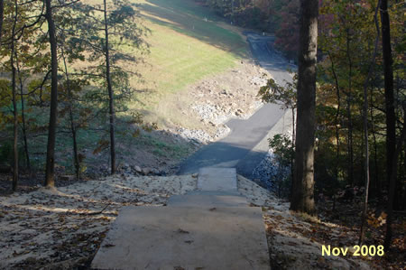 Follow the steps down to the base of the dam.