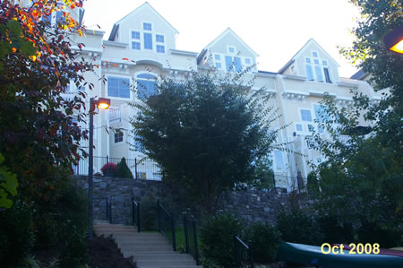 The homes to the left are 5 stories tall and have elevators.