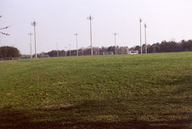 At the top of the hill athletic fields are seen to the left.
