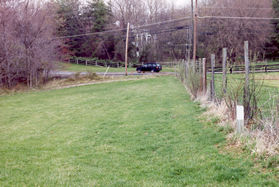 Turn left at the white marker shown just prior to Hunter Mill Rd and proceed across the grass parallel to Hunter Mill Rd.