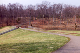 After climbing a small hill turn left to follow the paved path across the dam.