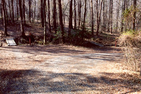 Take the road as it turns to the right. Do not take the path across the bridge shown.