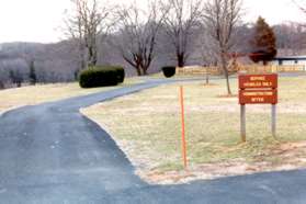 Walk from the parking lot taking the path to the left of the park office.