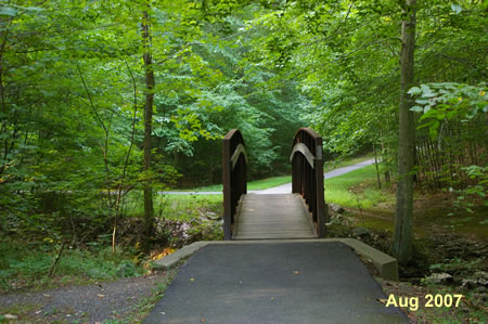 The trail crosses a narrow bridge over South Run.