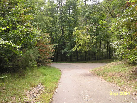 The trail joins the Lake Mercer loop trail at point 11 on the map.  Go straight on the asphalt trail past the barrier.  Go to point 12 in the directions.