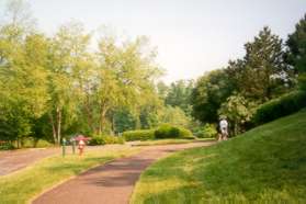 Follow the path towards  the Lake with the small office on the right.