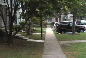 The trail leads into a sidewalk in front of homes along Bennington Woods Ct. Keep straight so that the houses are on your left.