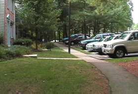 The path becomes a sidewalk in front of homes on Stowe Ct.