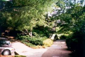 Take the path on the right in front of the homes.