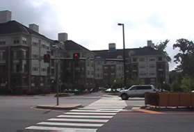 Cross Reston Parkway at the traffic light.