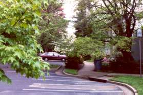 The asphalt path leads to a sidewalk through Waterview Cluster.  Follow the sidewalk.