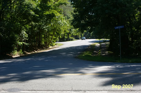 Cross Lawyers Rd to the sidewalk on the other side.