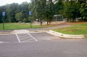 Take path directly away from parking lot and next to baseball field.