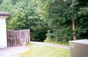 Turn right at shopping area and go down steep short hill.