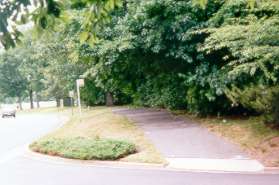 The trail crosses Greenkeepers Ct and continues along South Lakes Dr.