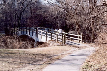 The asphalt path crosses Rock Creek.  Do not take the dirt path to the right prior to the bridge.