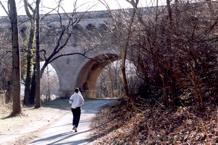 The path goes under the Dumbarton (Buffalo) Bridge that takes Q Street over the park.