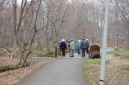 Crossing a bridge over the outlet stream from Lake Anne.