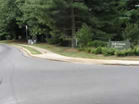 Continue on the sidewalk along Soapstone Dr. after crossing Golf Course Sq.