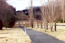 The trail crosses Southington Ln and heads down the hill towards Wiehle Ave.