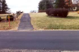 The trail crosses Deer Forest Rd and continues to follow the pipeline.