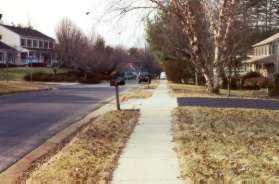 Continue on the sidewalk past Quail Ridge Dr shown on the left.