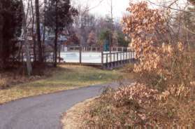 The trail rejoins the Autumnwood Park area with the pool on the left.  Do not turn right at the next trail.