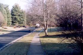 The trail intersects with Garrett St.  Turn right and follow the sidewalk.