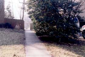 Woodland Ct. curves to the left.  Take the walkway between the homes to continue in the original direction of Woodland Ct.
