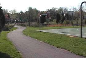 The correct trail will have a basketball court on the right.