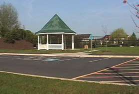 At the next trail intersection take the path to the right and follow the path along the right of the access road next to the gazebo.  Tennis courts are next to the gazebo.