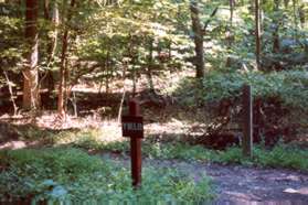 Turn left at the Uplands Trail crossing that is marked by signs.