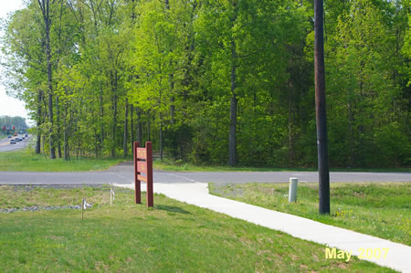 The trail intersects with the access road into Poplar Tree Park.