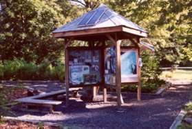 Walk back and view the information kiosk at the end of the parking lot.