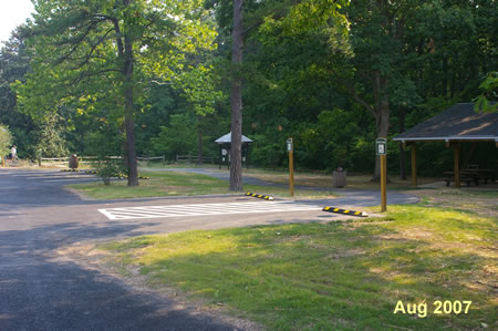 Turn right onto the asphalt trail leading to the picnic pavilion. The trail turns left prior to the pavilion.