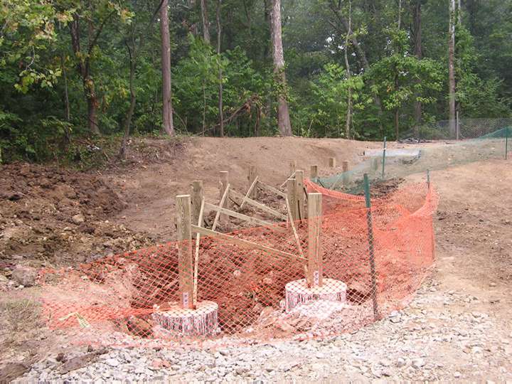 Foundation laid for boardwalk in wet area.