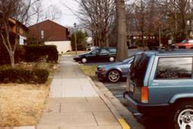 After walking up the hill turn left onto the sidewalk at the street.