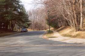 Cross the second appearance of Olde Crafts Dr and take the sidewalk along the right side of Barrel Cooper Ct.