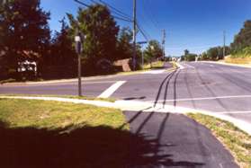 Turn left and follow the sidewalk at the next street which is Butter Churn Dr.