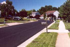 Turn right and follow the sidewalk across the street.