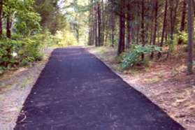 The trail goes up the hill and joins Sugarland Rd.  Continue along the side of Sugarland Rd after the asphalt trail ends.