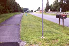 After crossing Holly Knoll Dr turn right and follow the asphalt trail on the other side.