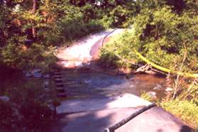 The trail crosses Sugarland Run on columns.