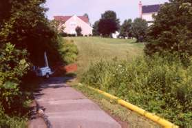 The trail goes up a slight hill and turns right.