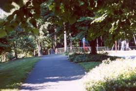 Take the trail from the parking lot away from the street with the playground equipment on your right.